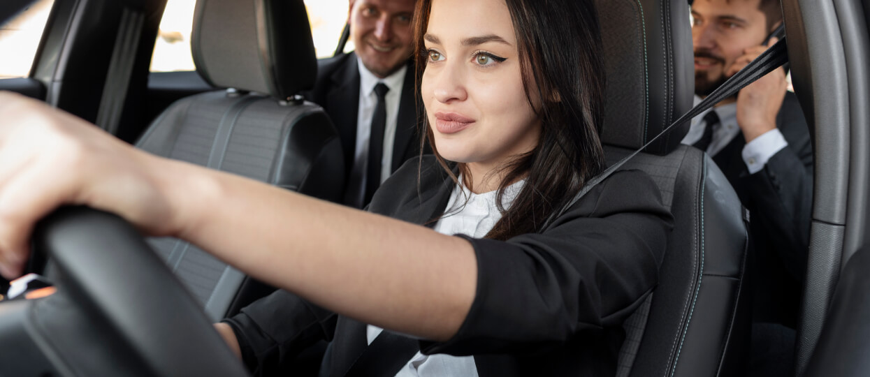 Taxi driver with clients in the car