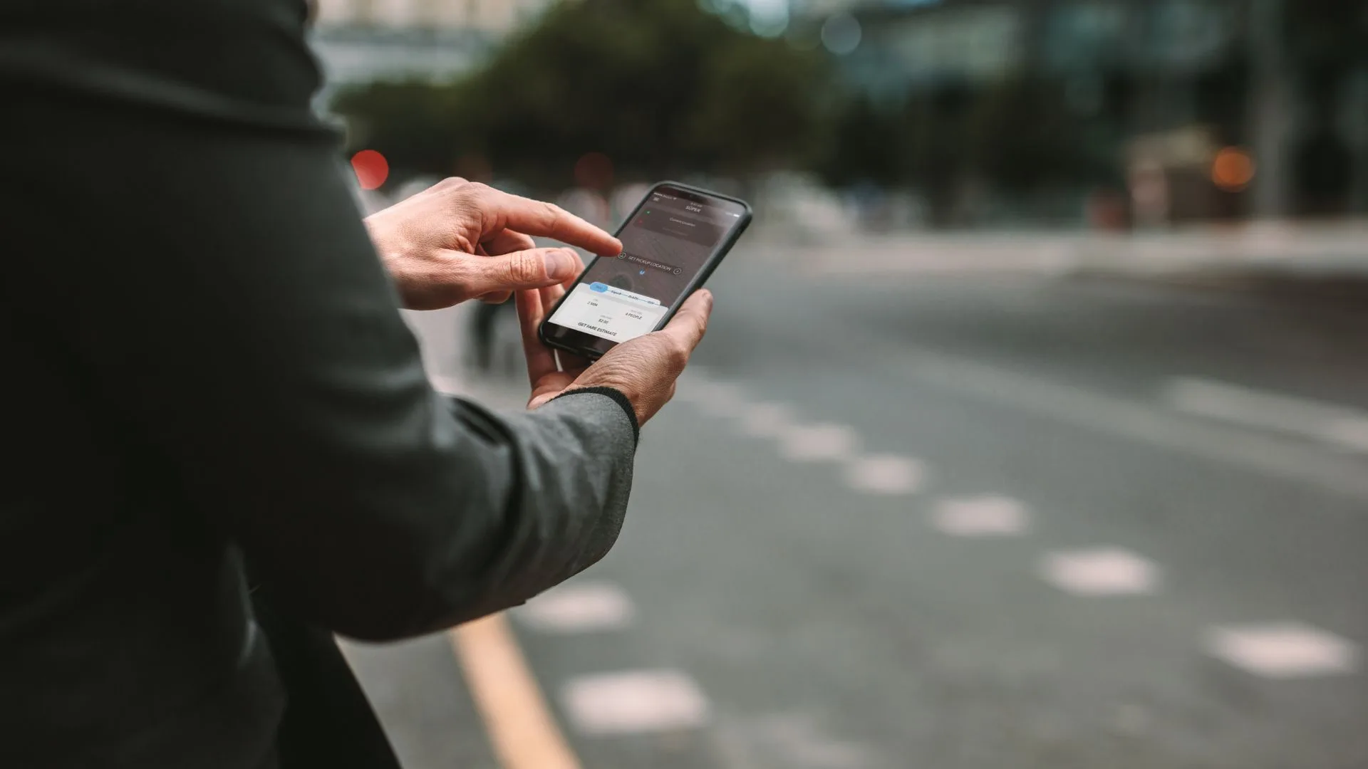 person using taxi app alternative for uber in albania