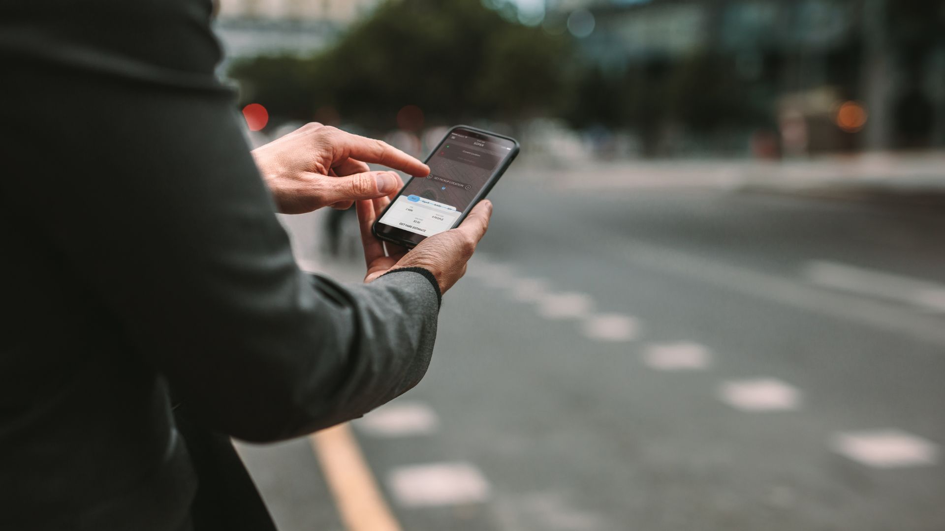 person using taxi app alternative for uber in albania